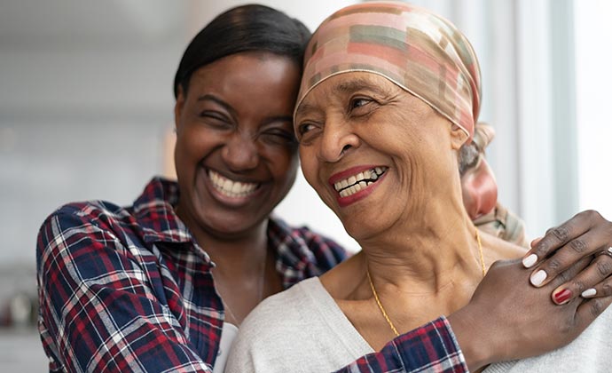 A woman embraces her mother