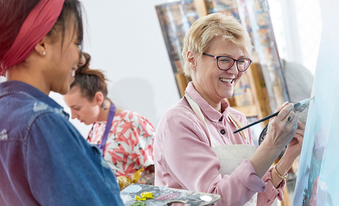 A group paints during an art therapy activity